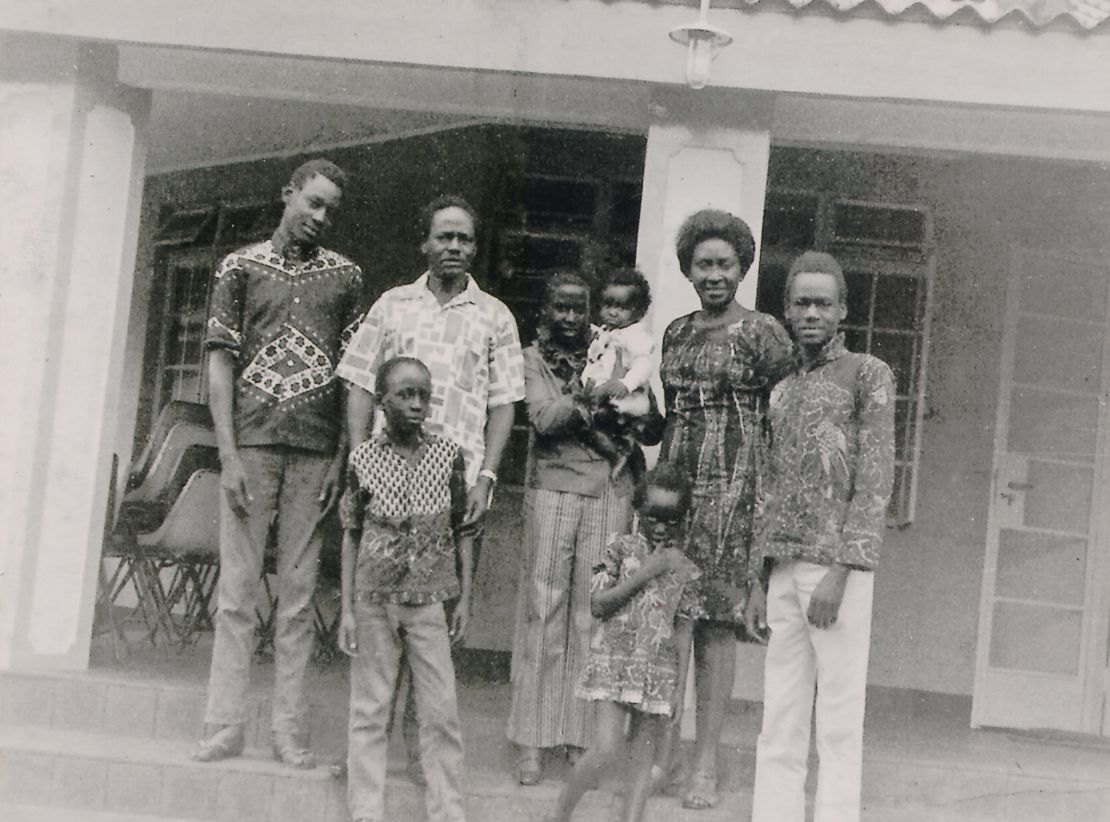 Gladys Kalema-Zikusoka (the baby in the center) surrounded by her family. Her father, second from the left, went missing in 1971 when she was just two years old.