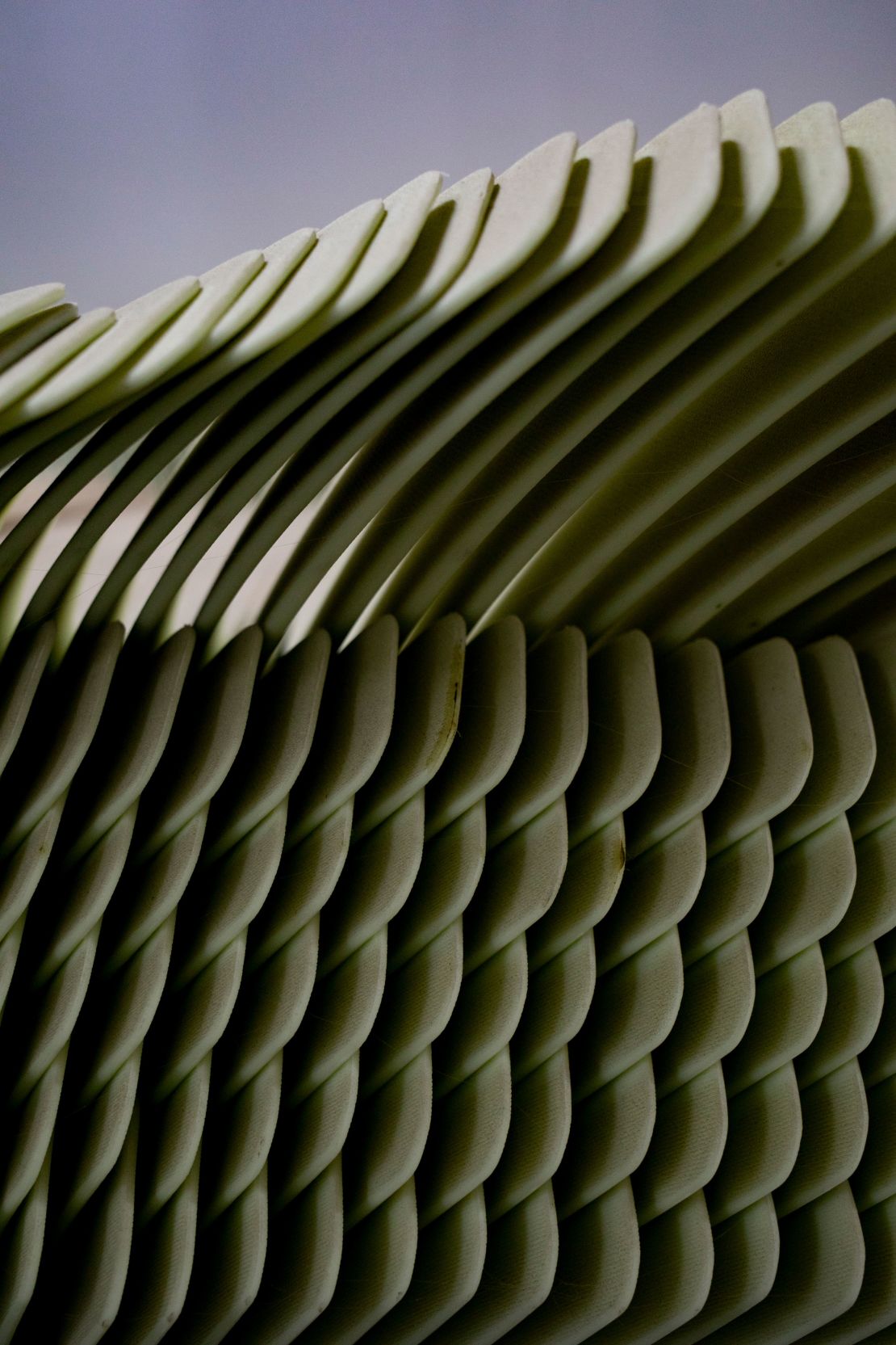 Finished hockey sticks are stacked inside the Roustan Hockey factory.