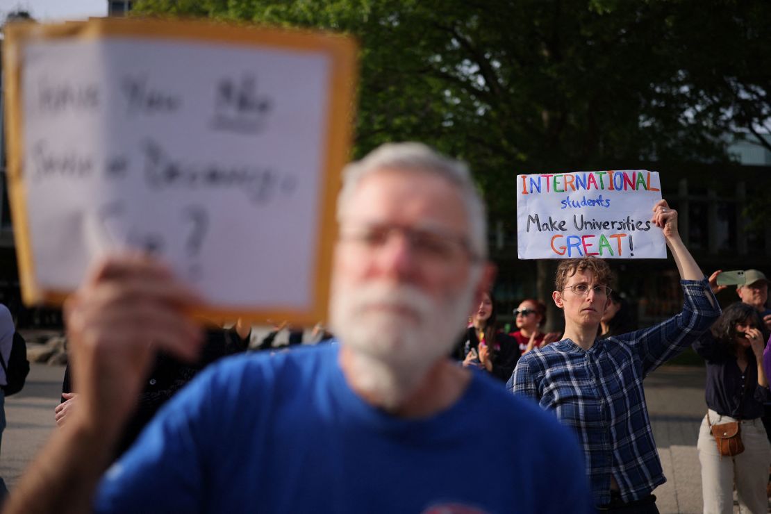 People participate in a "Harvard Stand United" rally in support of the school