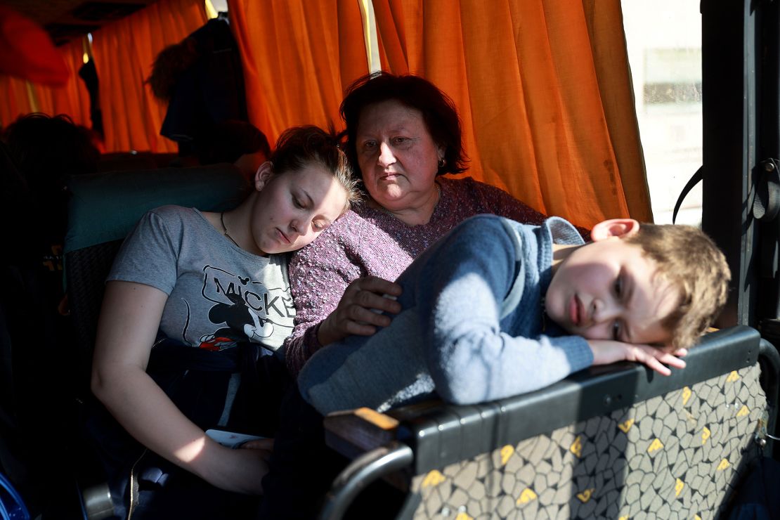 Evacuees from Mariupol wait on a bus after arriving safely by train in Lviv, western Ukraine, in March 2022.
