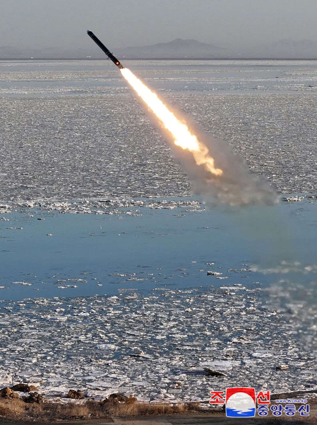 A missile flies during what North Korean state media described as a test-launch of a strategic cruise missile, designed to demonstrate the readiness of various nuclear capabilities, off the west coast of the Korean peninsula, on February 26, 2025, in this photo released by North Korea